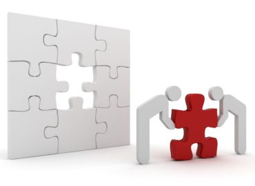 Teamwork people building solution puzzle